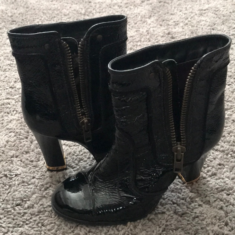 Black heeled booties with gold accent